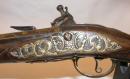 Long pistolet à garnitures argent et bronze, vers 1730