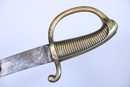 Sabre briquet, marqué VERSAILLES, sans fourreau. Lame légèrement raccourcie
