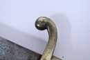 Sabre briquet, marqué VERSAILLES, sans fourreau. Lame légèrement raccourcie