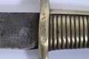 Sabre briquet, marqué VERSAILLES, sans fourreau. Lame légèrement raccourcie