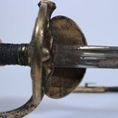 Épée d'officier subalterne, modèle 1857, clavier à l'aigle déployé, fourreau sans bouterole.