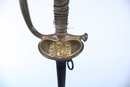 Épée d'officier du service de santé 2. Filigrane détendu (manques) . Bouton poussoir fonctionnel. Modèle 1855 transformé en 1872. 3 ème rep.