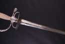 Épée de cour argentée époque Louis XVI. Lame gravée sur 80 % de la longueur.
