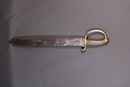 Sabre briquet, marqué Versailles, à lame à dents de scie. 