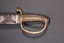 Sabre briquet, marqué Versailles, à lame à dents de scie. 