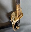 Sabre d'officier d'infanterie modèle 1845. Fourreau sans bouterole, un anneau manquant.