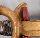 Sabre de cavalerie légère modèle 1882. Verni, lame marquée.
