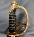 Sabre d'officier de carabinier ou de cavalerie de réserve. Modèle de 1854 modifié. Fourreau neuf.
