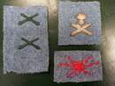 Lot de 4 insignes de la Grande guerre sur drap bleu horizon.